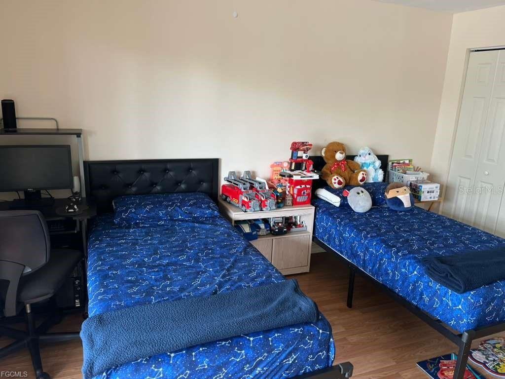 22278 Vick Street, Unit A112 Punta Gorda, FL 33980 - Photo 27 of 33 a bed room with a bed and a couch