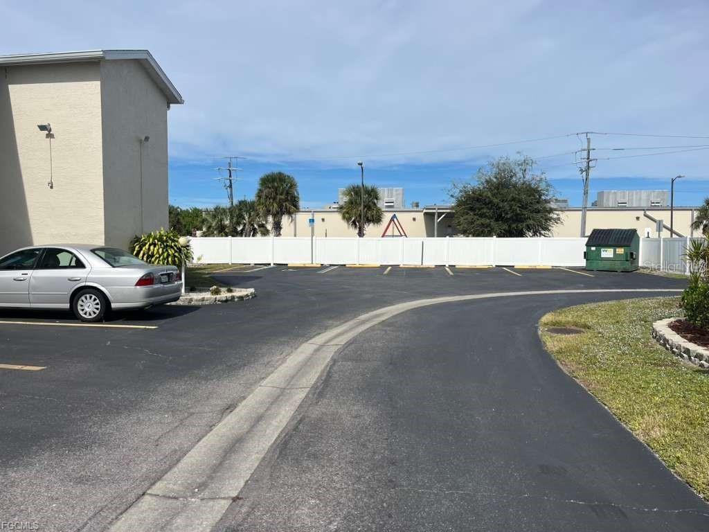 22278 Vick Street, Unit A112 Punta Gorda, FL 33980 - Photo 29 of 33 a car parked on the side of the road