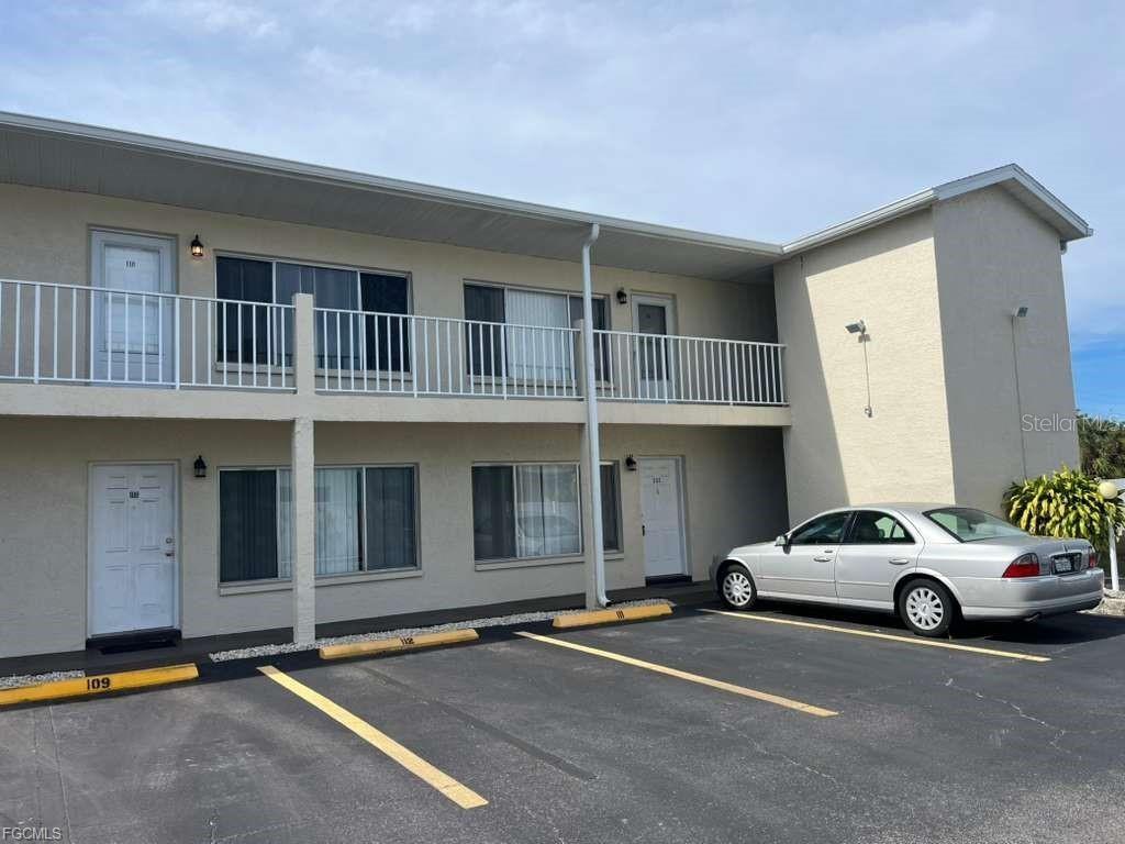 22278 Vick Street, Unit A112 Punta Gorda, FL 33980 - Photo 32 of 33 a car parked in front of a house