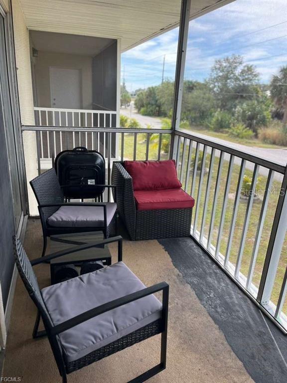 22278 Vick Street, Unit A112 Punta Gorda, FL 33980 - Photo 6 of 33 a view of a two chairs in the balcony