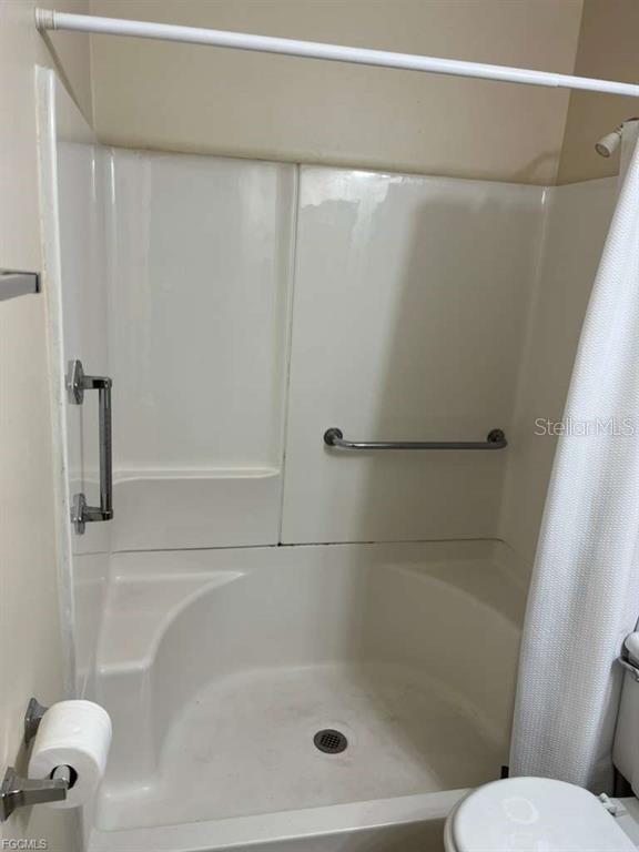 22278 Vick Street, Unit A112 Punta Gorda, FL 33980 - Photo 10 of 33 a bathroom with a shower and toilet