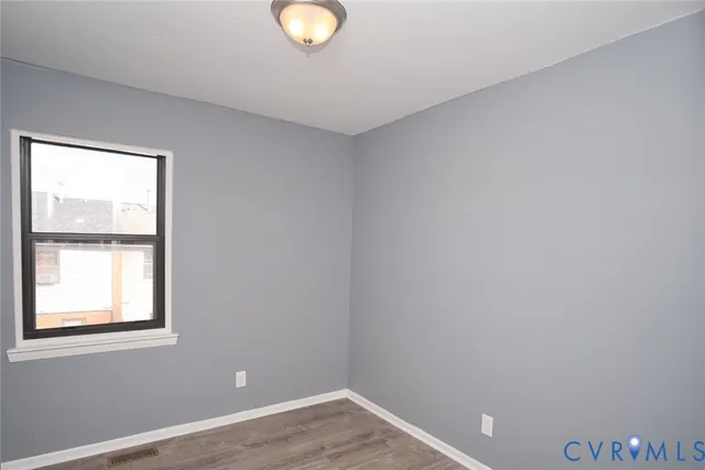 a bathroom with a toilet a sink and a mirror