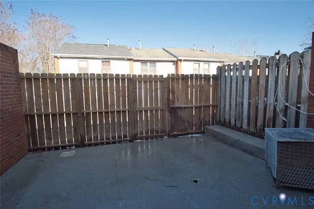 a view of a brick house with many windows