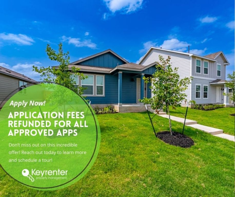 a view of a white house with a swimming pool and a yard