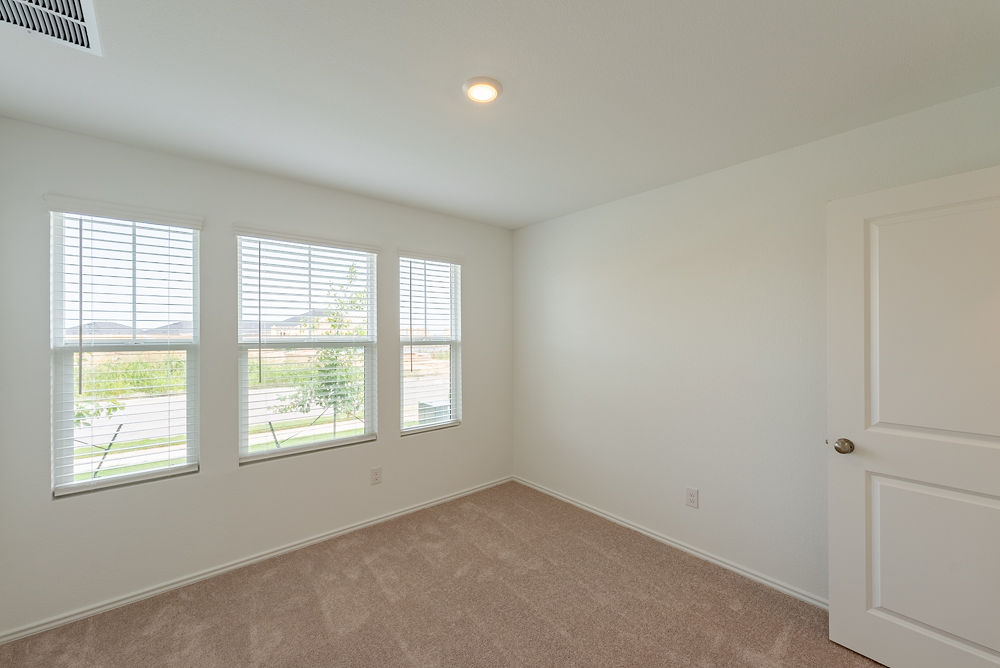 126 Avre Loop Kyle, TX 78640 - Photo 12 of 19 an empty room with a window