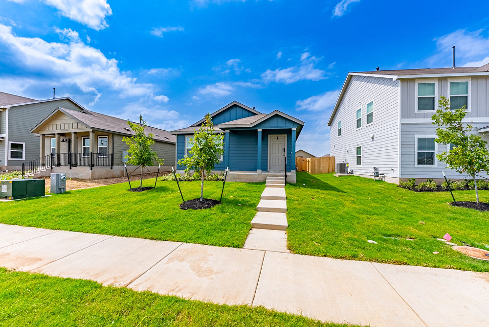 126 Avre Loop Kyle, TX 78640 - Photo 2 of 19 a front view of a house with a yard