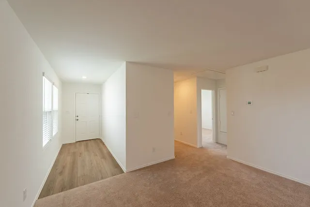 a view of an empty room and window