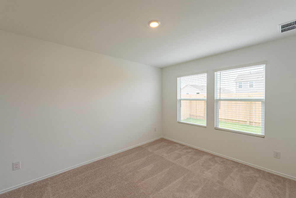 126 Avre Loop Kyle, TX 78640 - Photo 7 of 19 an empty room with a window