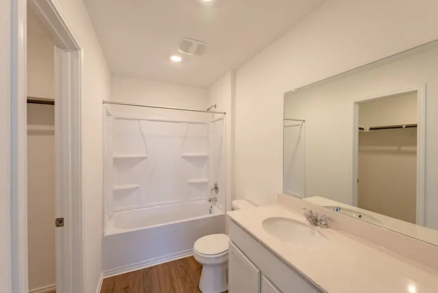 a kitchen with stainless steel appliances a refrigerator sink and microwave