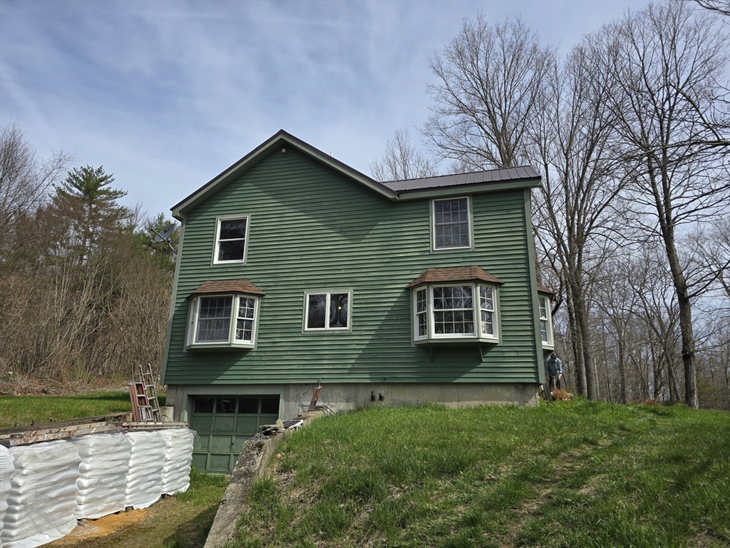 969 Brook Road Hardwick, MA 01037 - Photo 5 of 36 a front view of a house with garden