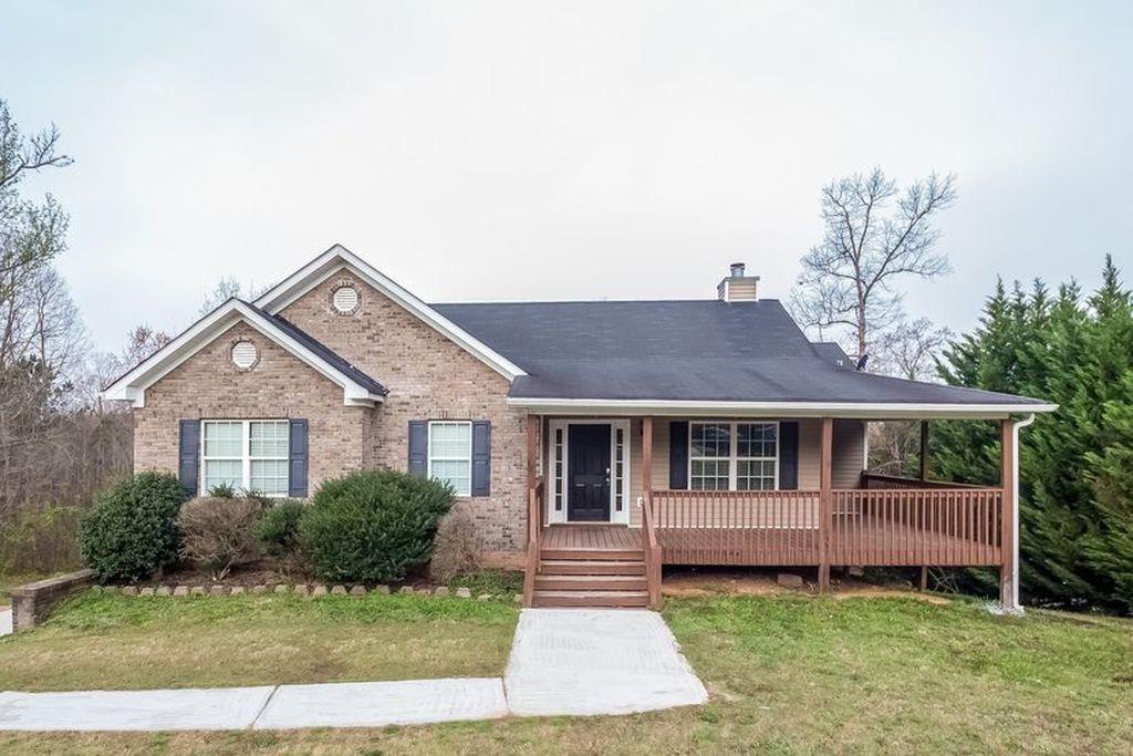 45 Kristen Place Covington, GA 30016 - Photo 1 of 1 a front view of a house with a yard