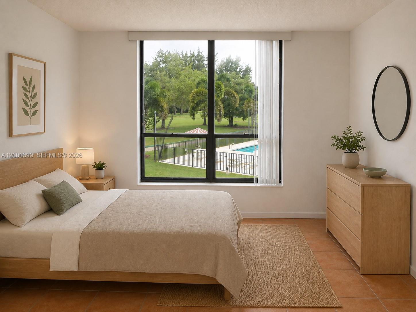8050 West McNab Road, Unit 206 Tamarac, FL 33321 - Photo 26 of 37 a bedroom with a bed and a large window