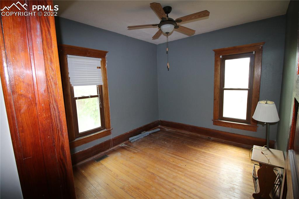604 South Main Street Fowler, CO 81039 - Photo 13 of 50 a view of empty room with wooden floor and fan