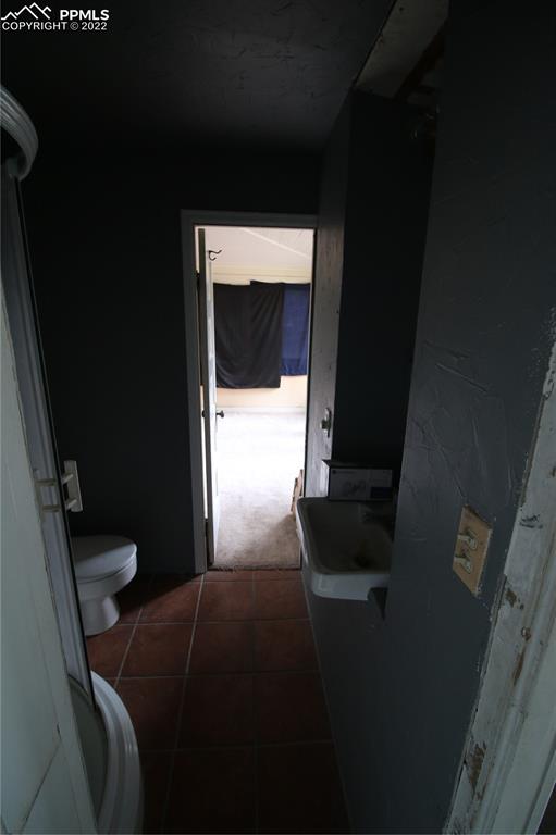 604 South Main Street Fowler, CO 81039 - Photo 16 of 50 a bedroom with a bed and a window