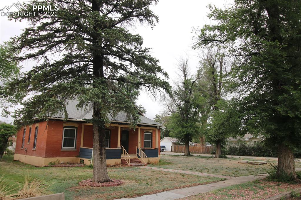 604 South Main Street Fowler, CO 81039 - Photo 37 of 50 a view of a backyard with large trees