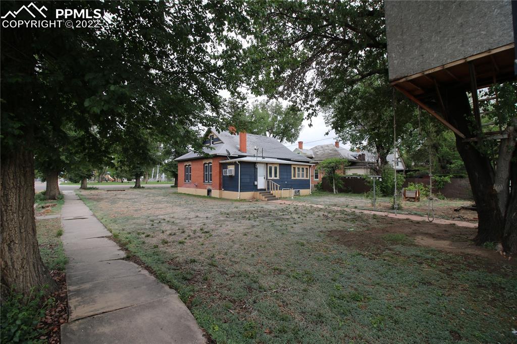604 South Main Street Fowler, CO 81039 - Photo 41 of 50 a front view of a house with a garden
