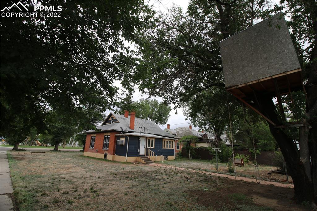 604 South Main Street Fowler, CO 81039 - Photo 44 of 50 a view of a house with a tree in front of it
