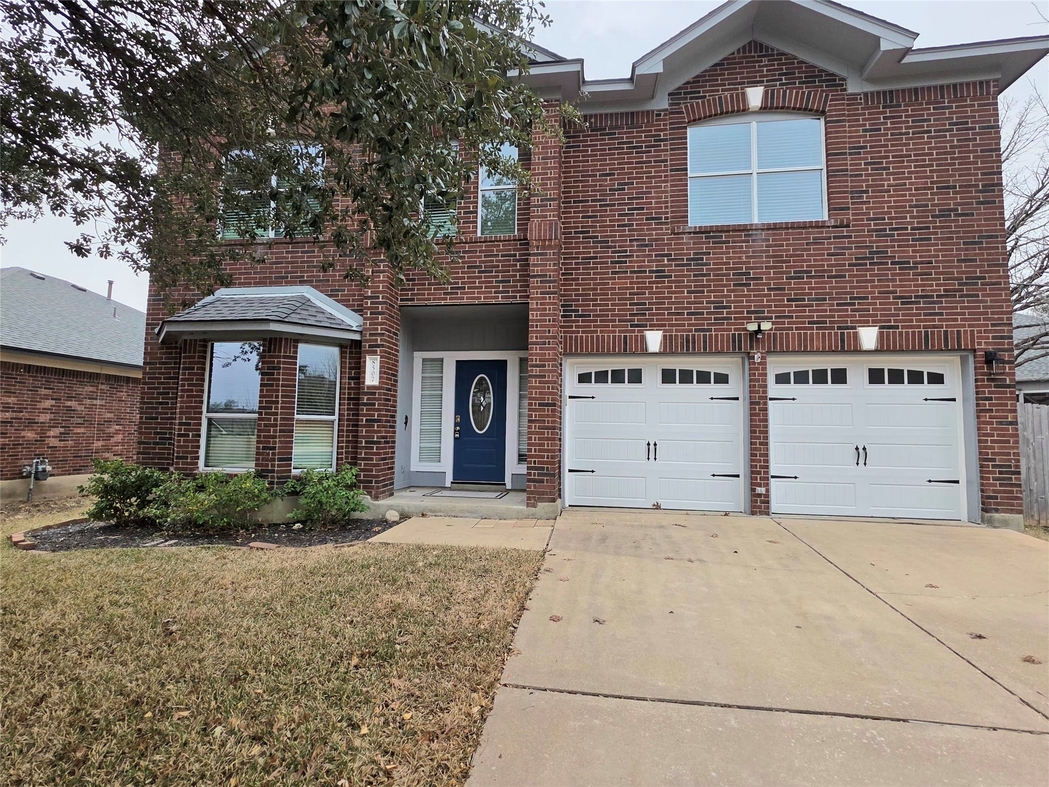 8507 Chat Lane Round Rock, TX 78681 - Photo 2 of 12 a front view of a house with a garden