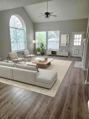 a living room with furniture and a large window
