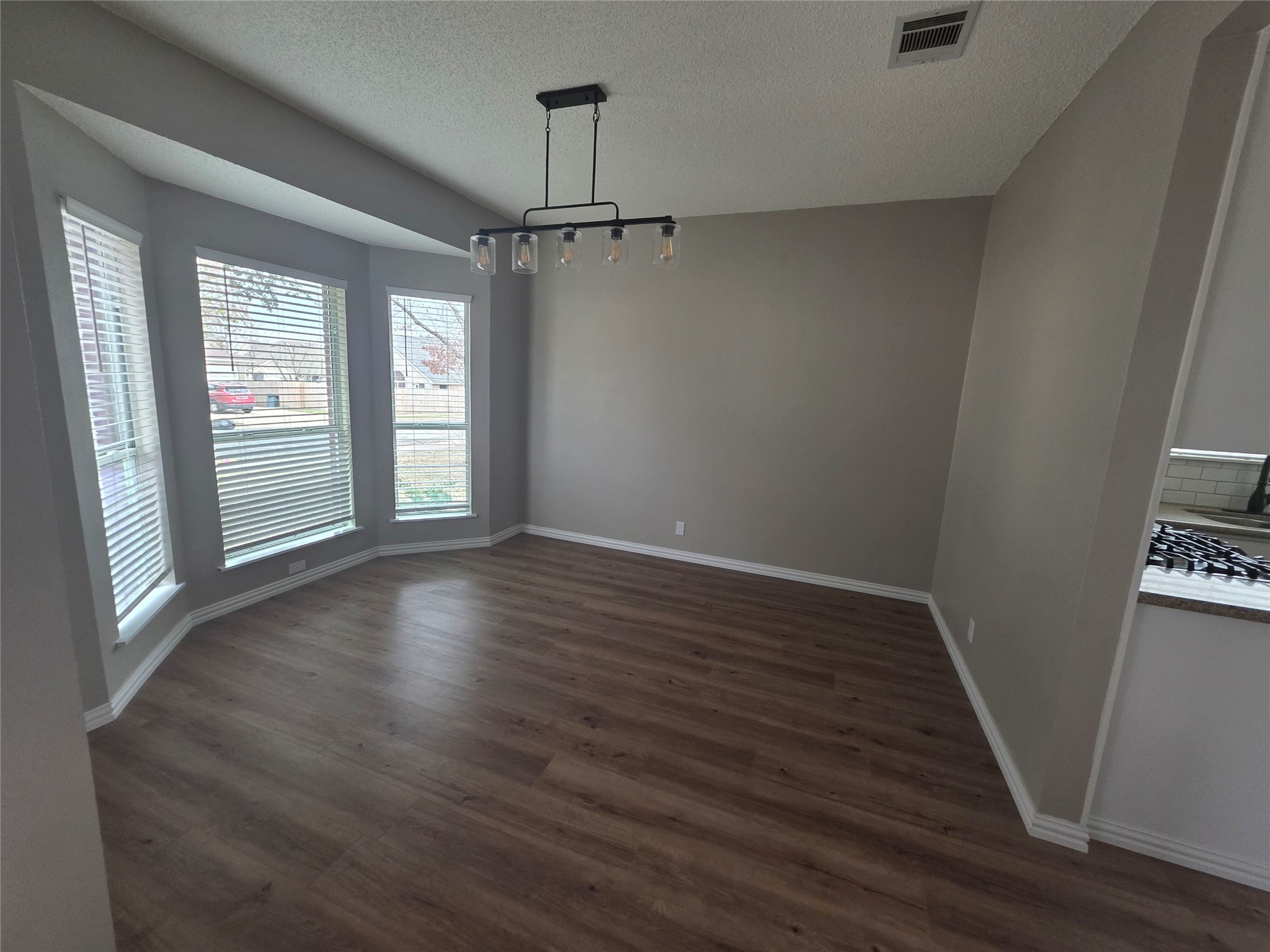 8507 Chat Lane Round Rock, TX 78681 - Photo 8 of 12 a view of an empty room with wooden floor and a window