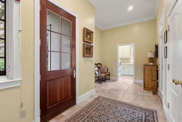 a view of a gallery with wooden floor