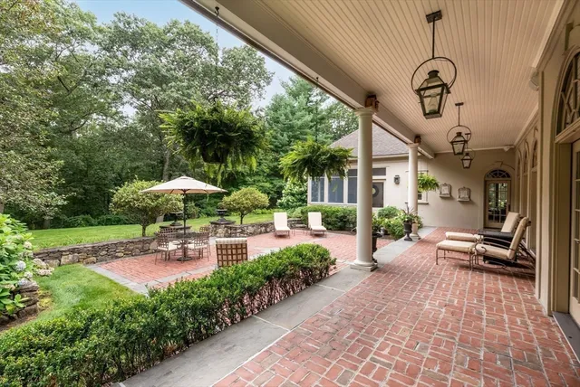 a view of a patio with chairs and tables