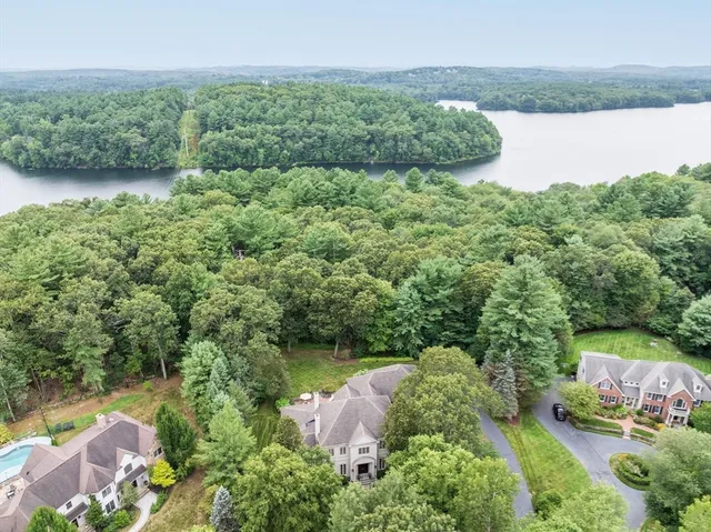 a view of a lake with houses in the back