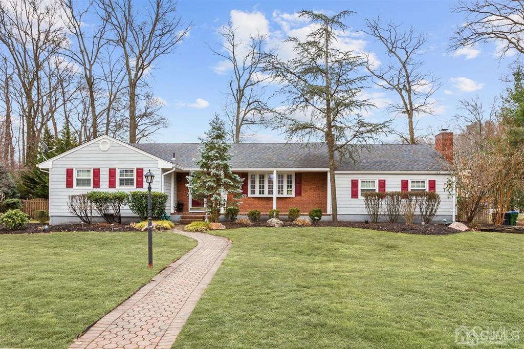6 Huntington Road Edison, NJ 08820 - Photo 1 of 23 a front view of a house with a yard
