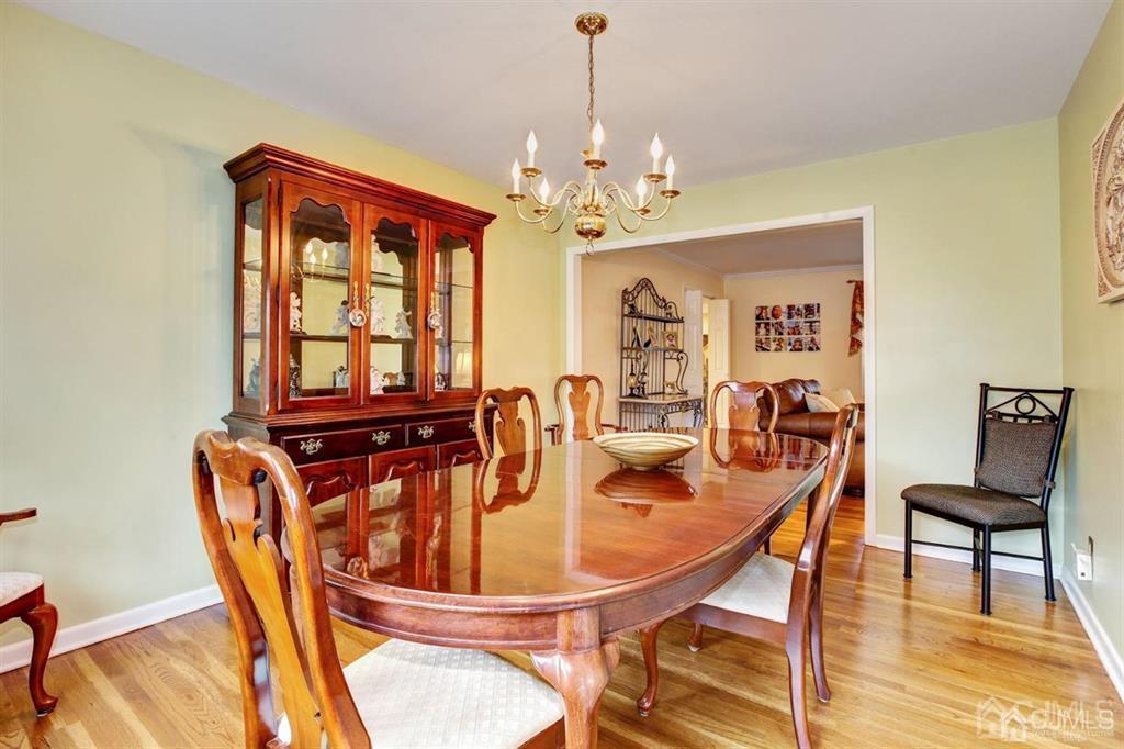 6 Huntington Road Edison, NJ 08820 - Photo 12 of 23 a view of a dining room with furniture window and wooden floor