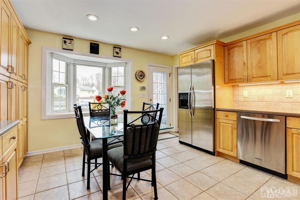 6 Huntington Road Edison, NJ 08820 - Photo 13 of 23 a view of a dining room with furniture and window