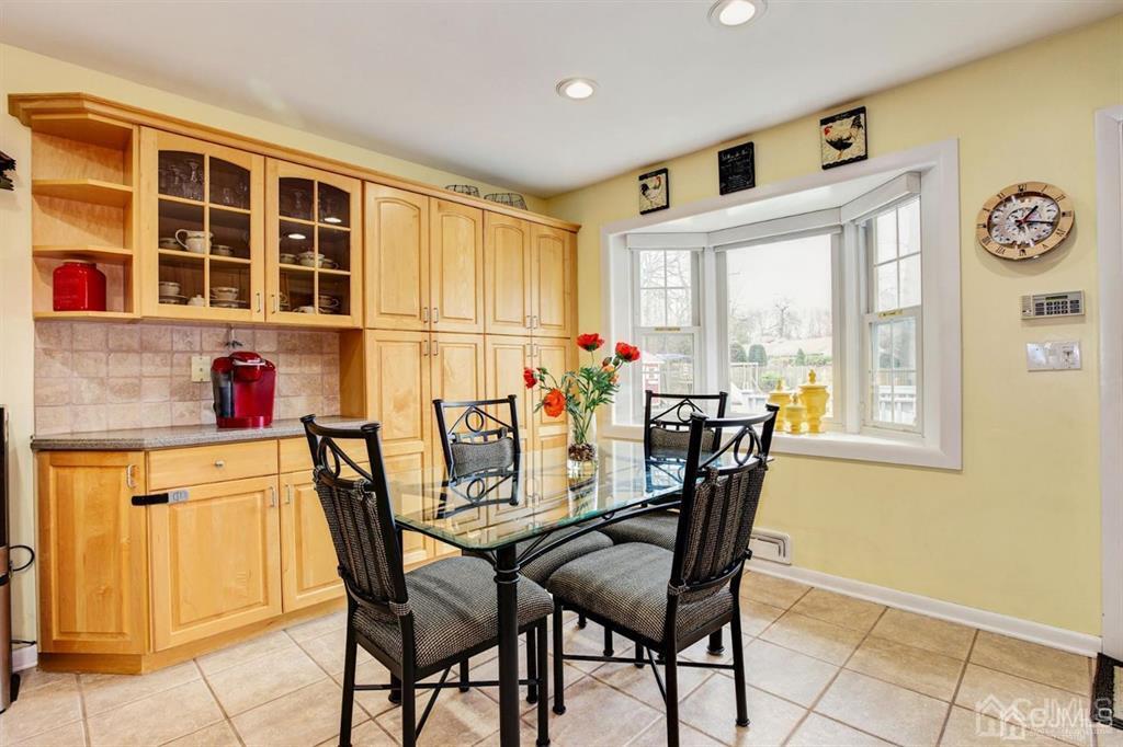 6 Huntington Road Edison, NJ 08820 - Photo 14 of 23 a view of a dining room with furniture and a window
