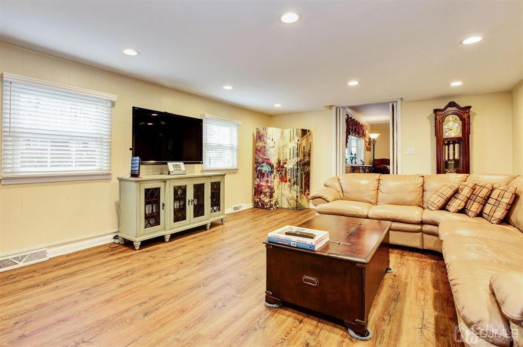 6 Huntington Road Edison, NJ 08820 - Photo 15 of 23 a living room with furniture and a flat screen tv