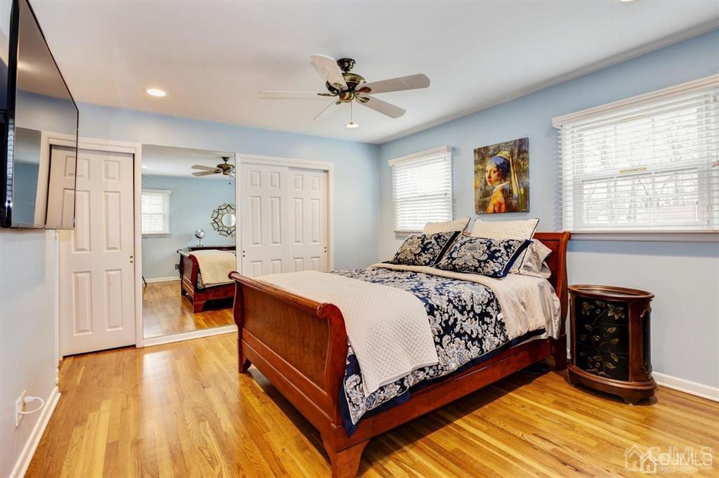 6 Huntington Road Edison, NJ 08820 - Photo 17 of 23 a spacious bedroom with a bed and wooden floor