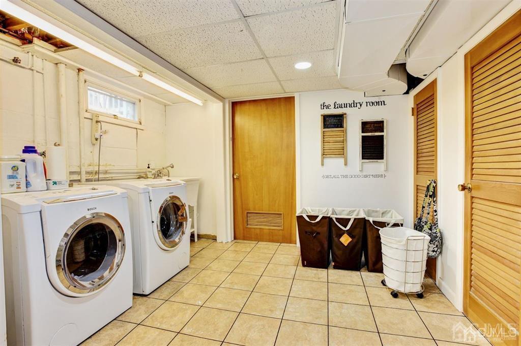 6 Huntington Road Edison, NJ 08820 - Photo 20 of 23 a bathroom with a sink a mirror and a shower