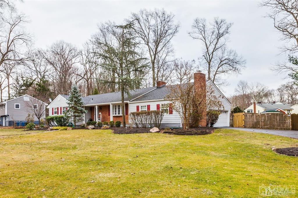 6 Huntington Road Edison, NJ 08820 - Photo 2 of 23 a front view of house with yard and trees around