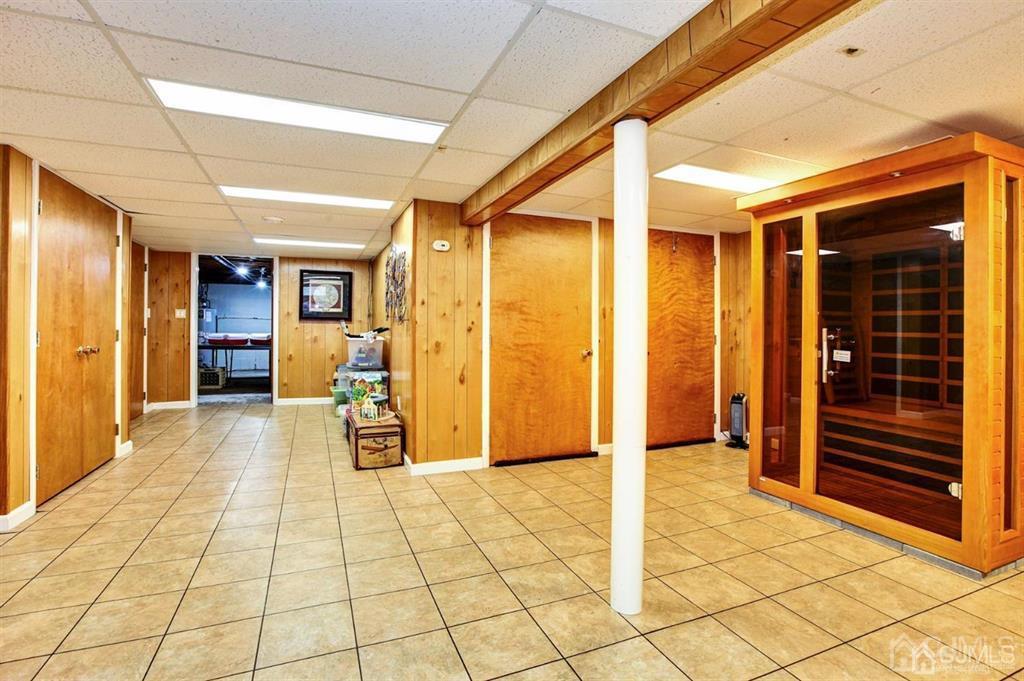 6 Huntington Road Edison, NJ 08820 - Photo 21 of 23 a view of a hallway with wooden cabinets
