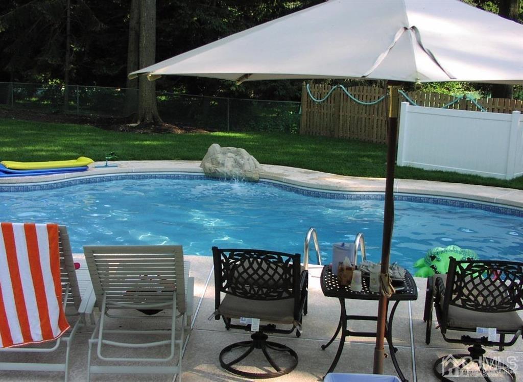 6 Huntington Road Edison, NJ 08820 - Photo 23 of 23 a front view of a house with garden