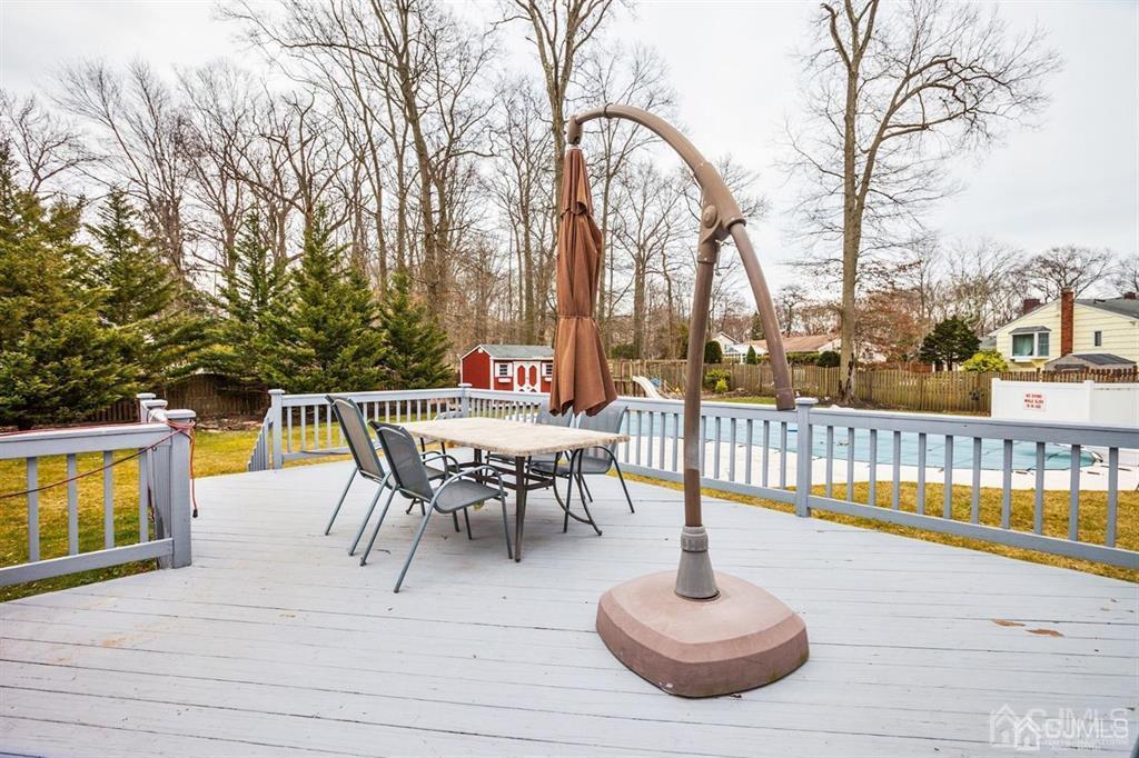 6 Huntington Road Edison, NJ 08820 - Photo 3 of 23 a view of a swimming pool with a lounge chair