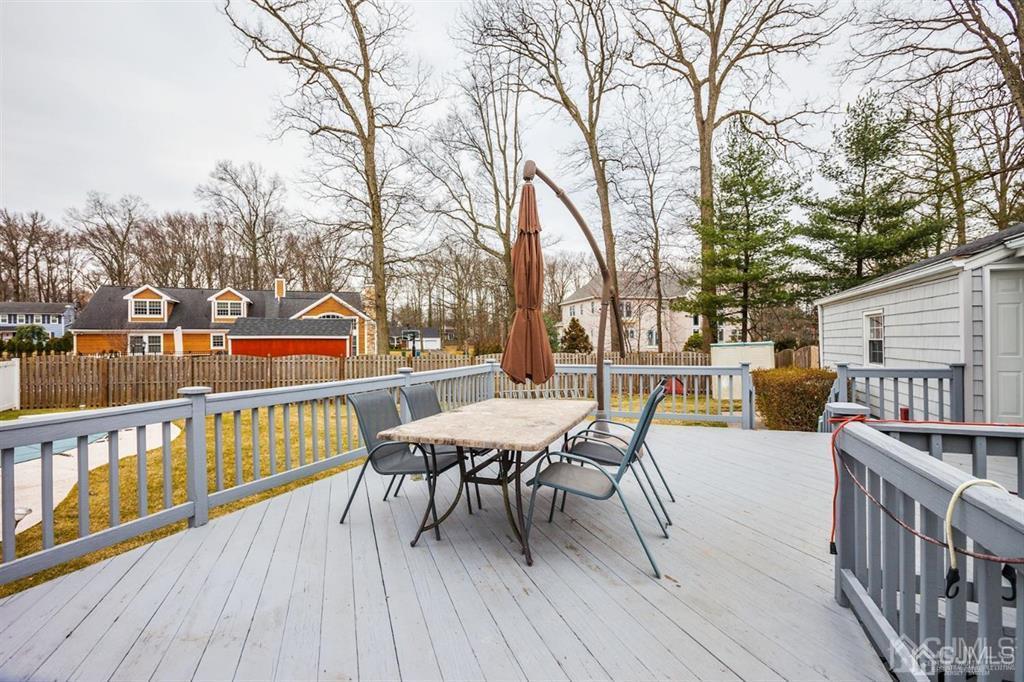 6 Huntington Road Edison, NJ 08820 - Photo 5 of 23 a balcony with wooden floor table and chairs