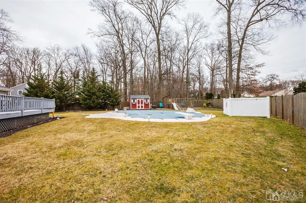 6 Huntington Road Edison, NJ 08820 - Photo 6 of 23 a swimming pool with wooden fence