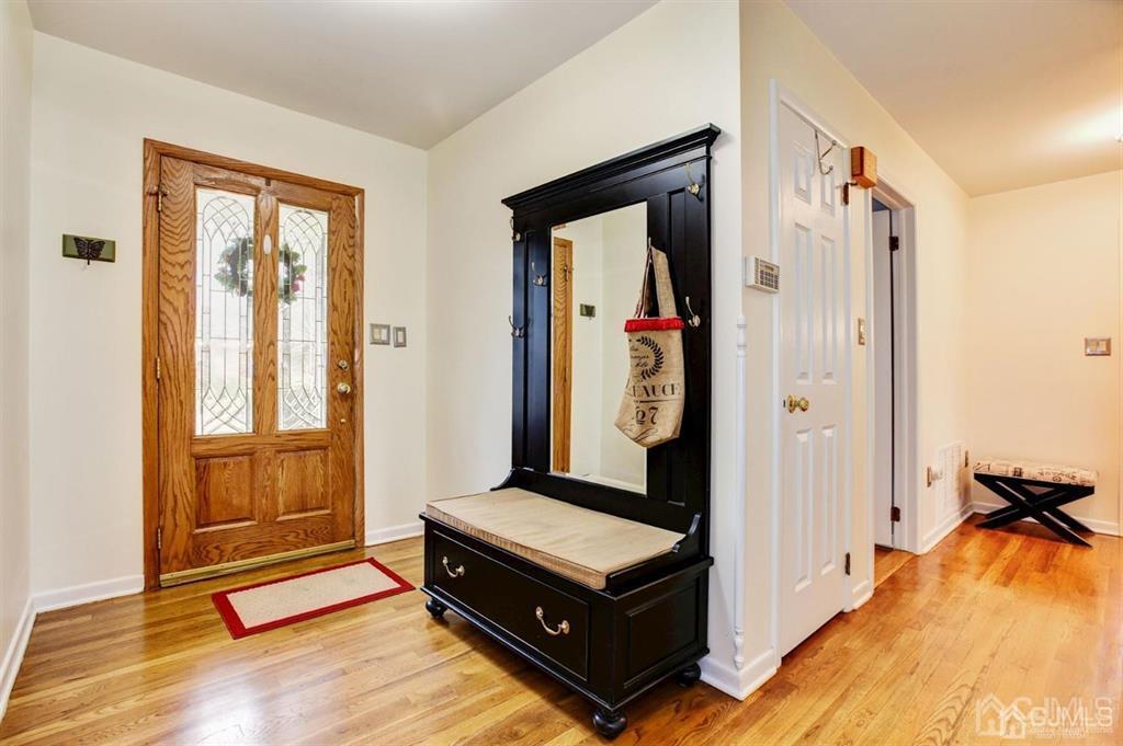 6 Huntington Road Edison, NJ 08820 - Photo 8 of 23 a living room with a bed and a window