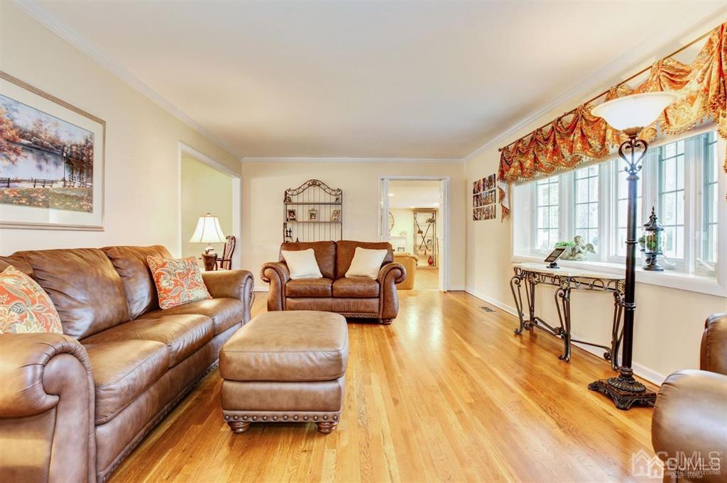6 Huntington Road Edison, NJ 08820 - Photo 9 of 23 a living room with furniture and a wooden floor