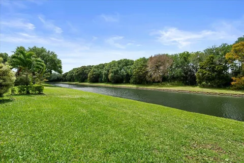 a view of a swimming pool and a yard
