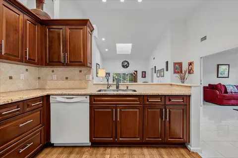 a kitchen with wooden cabinets and a sink