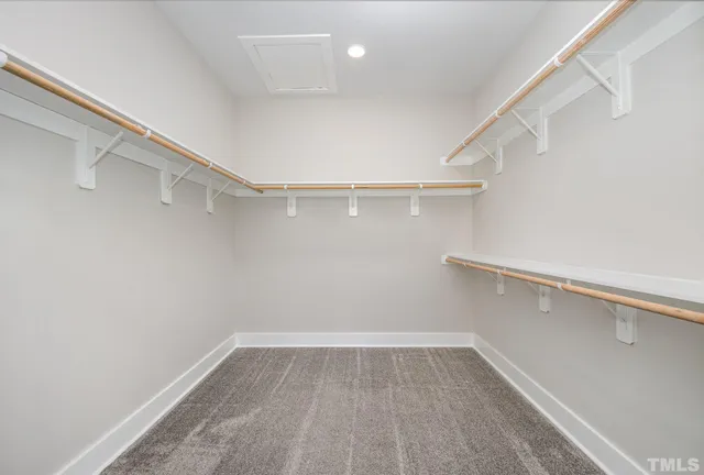 a view of an empty walk in closet