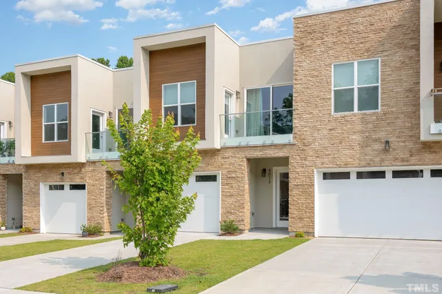 a front view of a house with yard