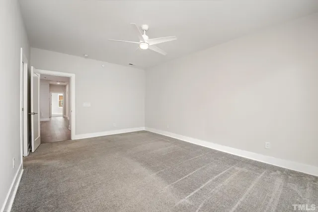 an empty room with a bathroom