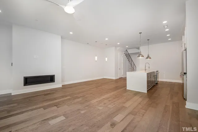 a view of a kitchen with a sink and a living room