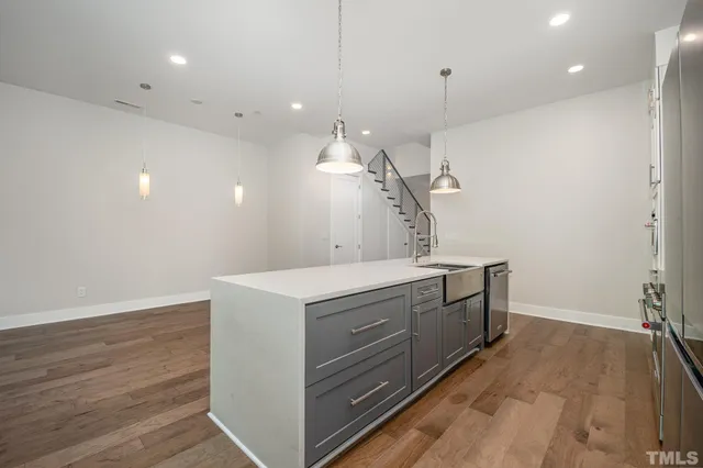 a utility room with faucet washer and dryer