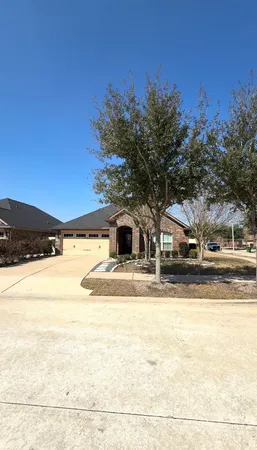 a front view of a house with yard